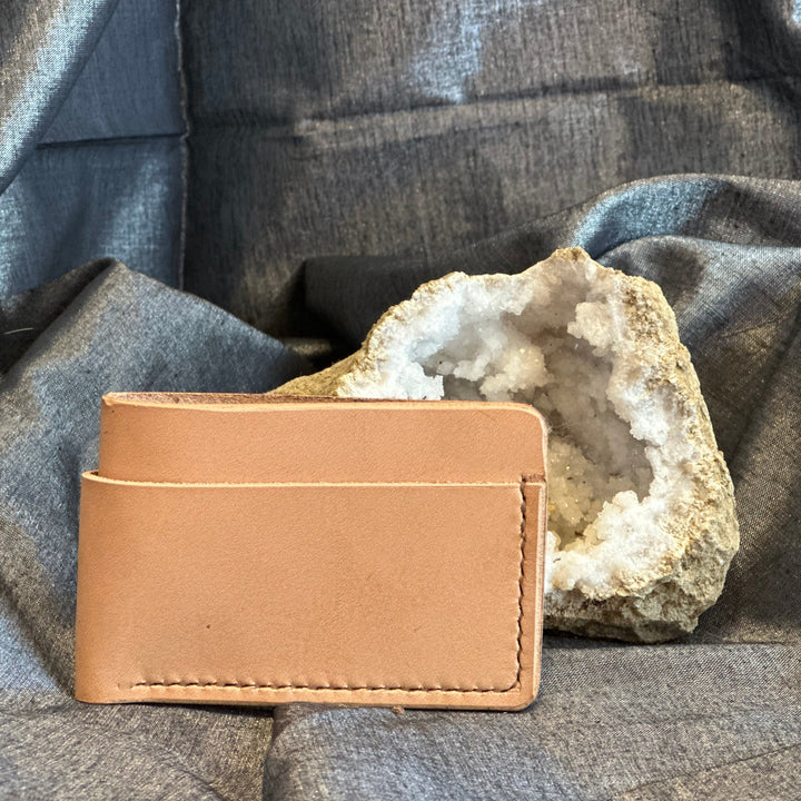 Veg Tan Horizontal Wallet is handmade with high quality top grain solid leather.  It is a slim fit wallet designed to carry your essentials and is constructed to last, endure, and abide.  Cards slide in and out horizontally and are oriented similarly to landscape mode on your phone.