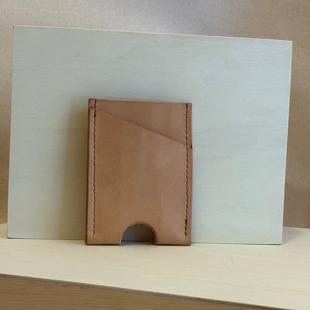 Our Veg Tan Vertical Wallet is handmade with high quality top grain solid leather.  It is a slim fit wallet designed to carry your essentials and is constructed to last, endure, and abide.  Cards slide in and out vertically and are oriented similarly to portrait mode on your phone.