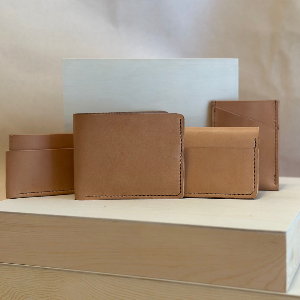 Our Veg Tan Vertical Wallet is handmade with high quality top grain solid leather.  It is a slim fit wallet designed to carry your essentials and is constructed to last, endure, and abide.  Cards slide in and out vertically and are oriented similarly to portrait mode on your phone.