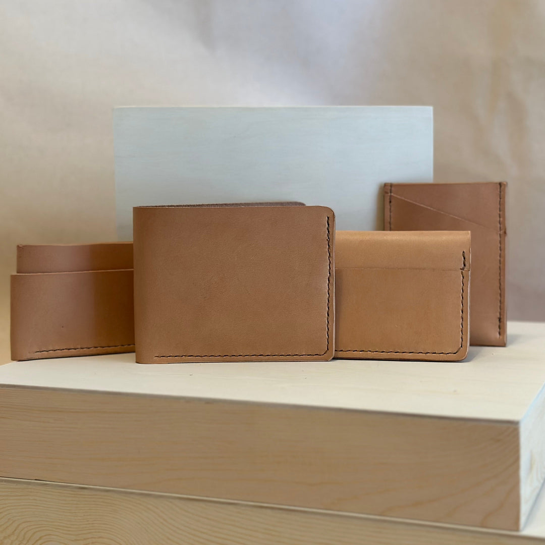 Our Veg Tan Vertical Wallet is handmade with high quality top grain solid leather.  It is a slim fit wallet designed to carry your essentials and is constructed to last, endure, and abide.  Cards slide in and out vertically and are oriented similarly to portrait mode on your phone.