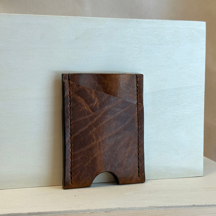 Our Glazed Bison Vertical Wallet is handmade with high quality top grain solid leather.  It is a slim fit wallet designed to carry your essentials and is constructed to last, endure, and abide.  Cards slide in and out vertically and are oriented similarly to portrait mode on your phone.