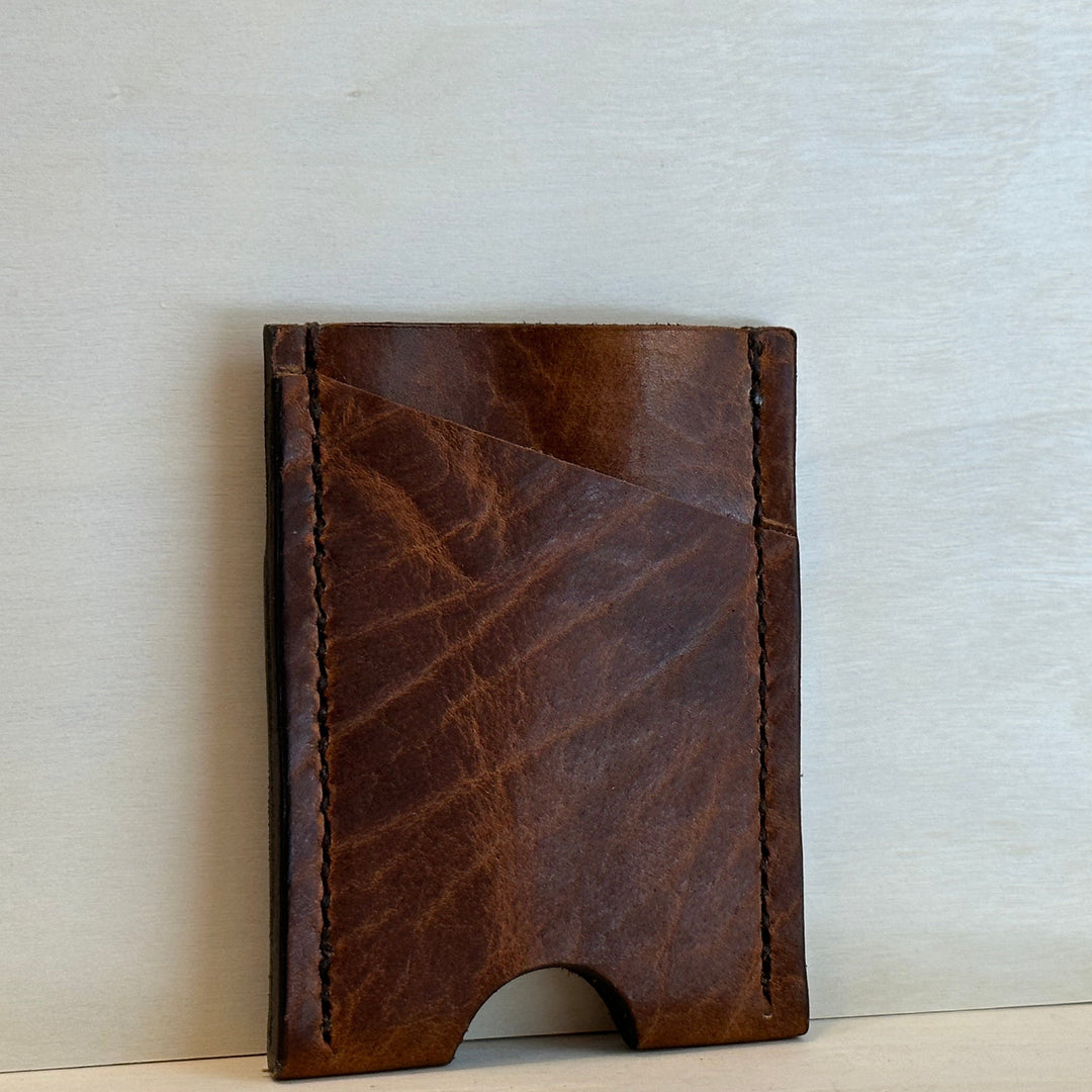 Our Glazed Bison Vertical Wallet is handmade with high quality top grain solid leather.  It is a slim fit wallet designed to carry your essentials and is constructed to last, endure, and abide.  Cards slide in and out vertically and are oriented similarly to portrait mode on your phone.
