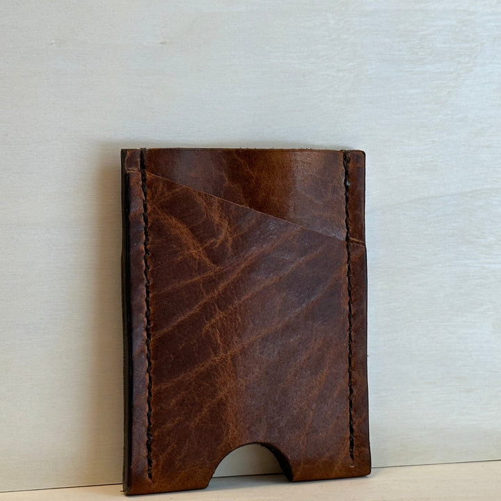 Our Glazed Bison Vertical Wallet is handmade with high quality top grain solid leather.  It is a slim fit wallet designed to carry your essentials and is constructed to last, endure, and abide.  Cards slide in and out vertically and are oriented similarly to portrait mode on your phone.