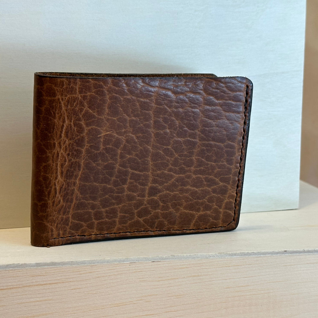 Our Glazed Bison Bi Fold Leather Wallet is handmade and hand stitched from high quality top grain solid leather.  It is a workhorse and makes a stylish statement from farm to table.  Perfect for your everyday carry and designed to last the test of time.