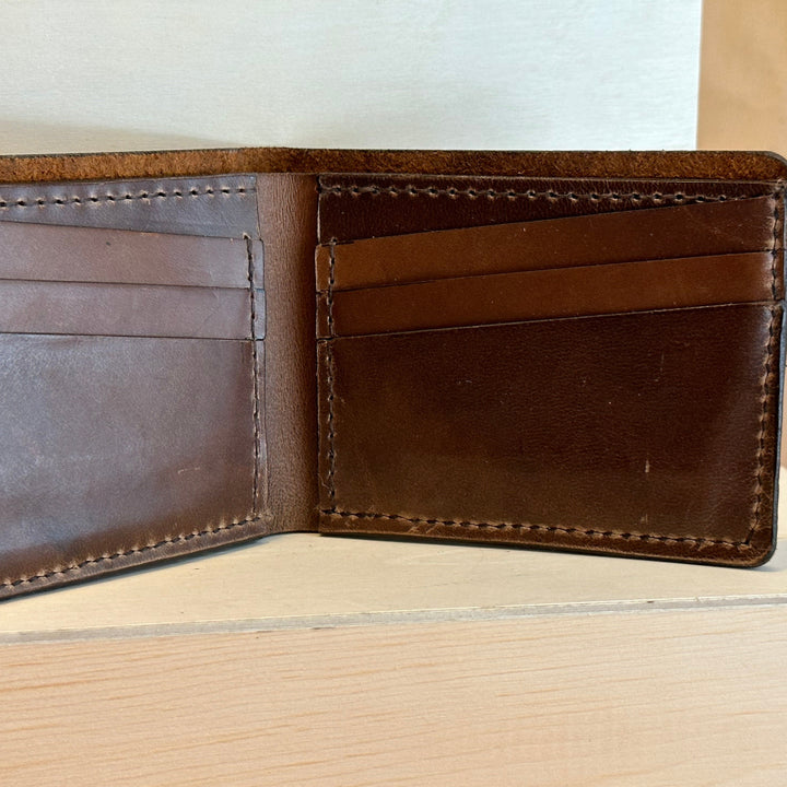 Our Glazed Bison Bi Fold Leather Wallet is handmade and hand stitched from high quality top grain solid leather.  It is a workhorse and makes a stylish statement from farm to table.  Perfect for your everyday carry and designed to last the test of time.