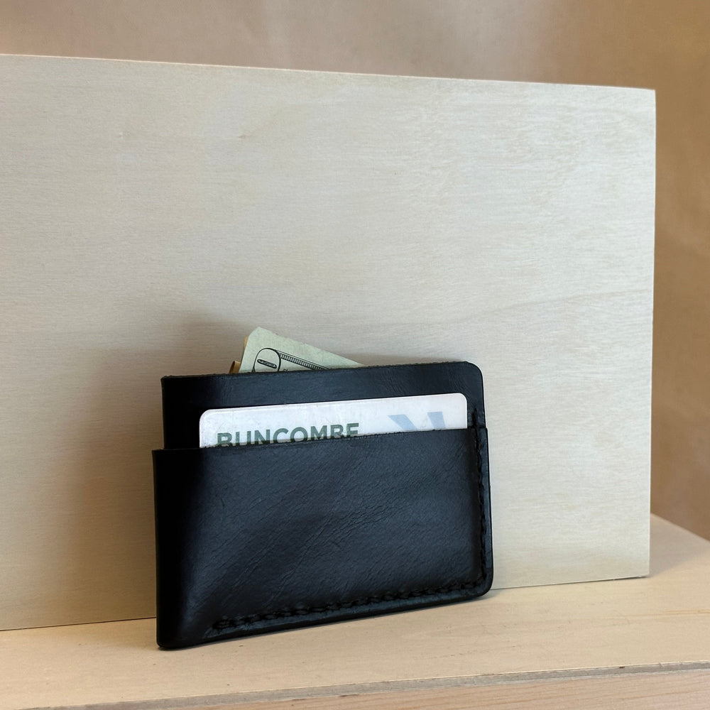 Black Horizontal Leather Wallet is handstitched out of top grain solid leather.