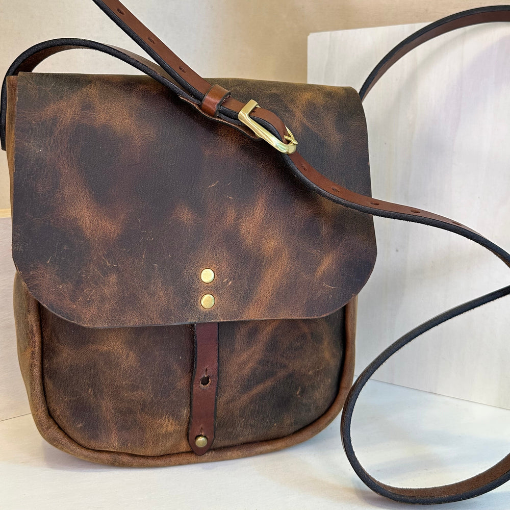 Our handmade Brown Pull Up Explorer Mini Crossbody Leather Bag is made from a beautiful brown pull up leather which gains a beautiful multi toned hue as it is used and gains its patina.  