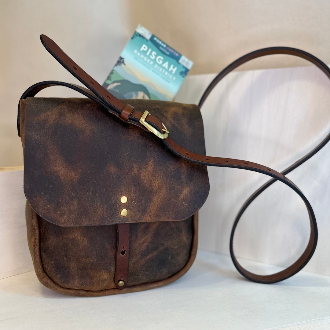 Our handmade Brown Pull Up Explorer Mini Crossbody Leather Bag is made from a beautiful brown pull up leather which gains a beautiful multi toned hue as it is used and gains its patina.  