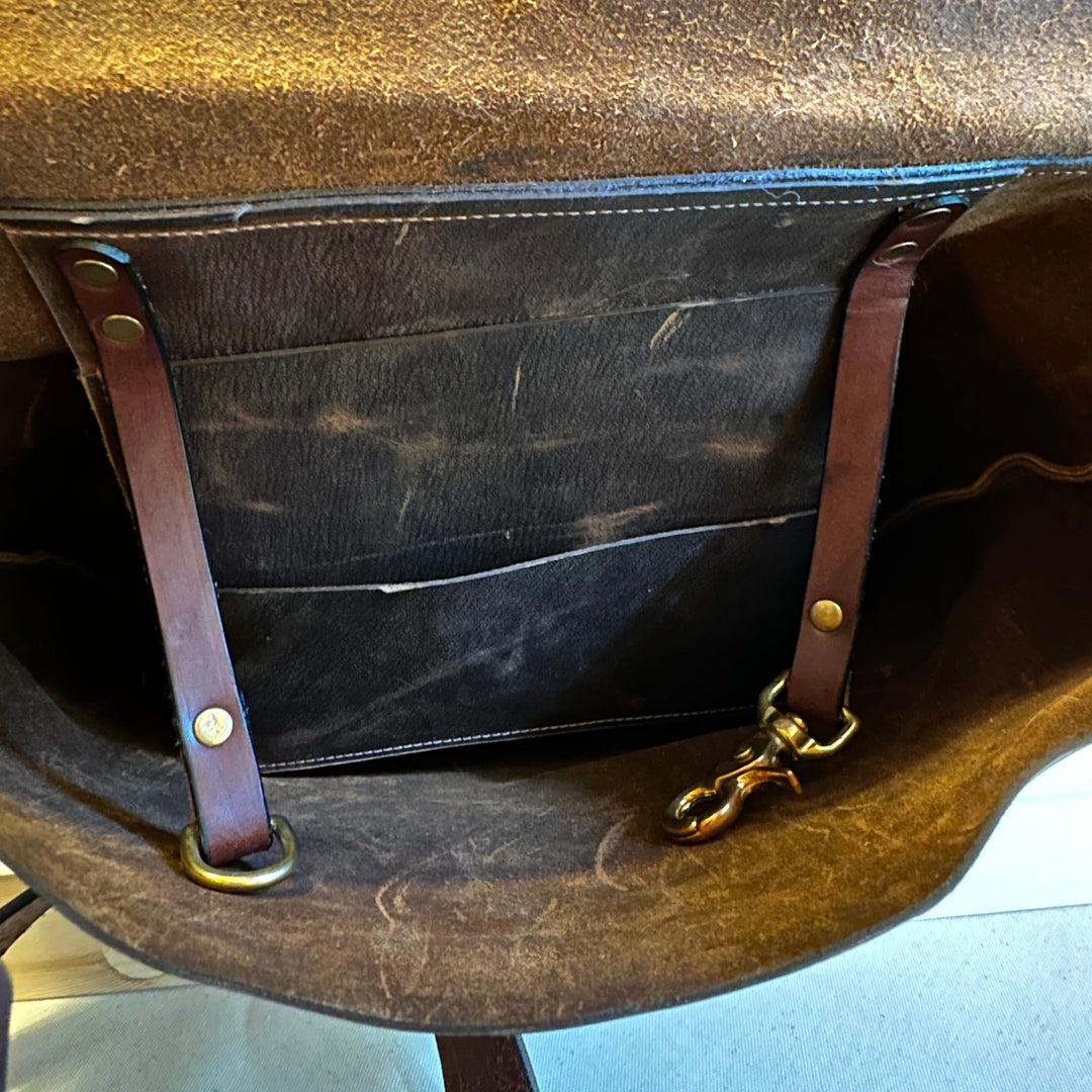 Shining Rock Goods Hand Stitched Brown Pull Up Leather Messenger Bag helps you get your message across loud and clear.  This messenger bag conveys impeccable style, accountability, durability, reliability, and investment.  Made of the finest quality, top grain solid leather with hand stitched seams and solid nickle silver.  This bag makes an excellent rite of passage gift to yourself or someone who has worked hard to acheive a goal, and has even more gratifying work ahead on their journey.