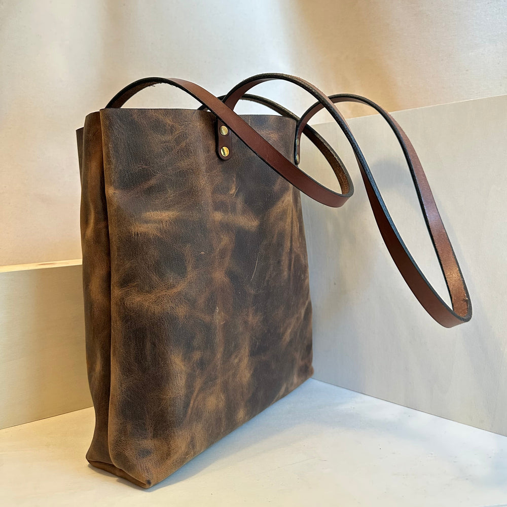 Our handmade Everyday Carry Large Brown Pull Up Leather Tote Bag is a work of art, work horse, workin' it kinda bag.  Crafted from the highest quality, USA tanned, solid, top grain leather,