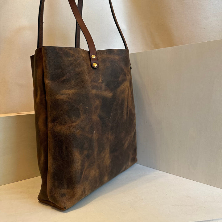 Our handmade Everyday Carry Large Brown Pull Up Leather Tote Bag is a work of art, work horse, workin' it kinda bag.  Crafted from the highest quality, USA tanned, solid, top grain leather,