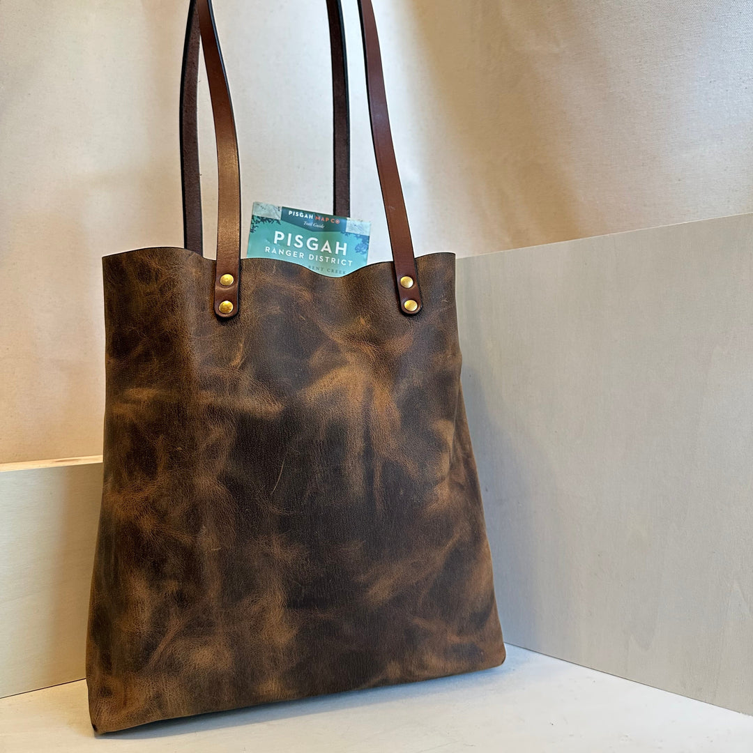 Our handmade Everyday Carry Large Brown Pull Up Leather Tote Bag is a work of art, work horse, workin' it kinda bag.  Crafted from the highest quality, USA tanned, solid, top grain leather,
