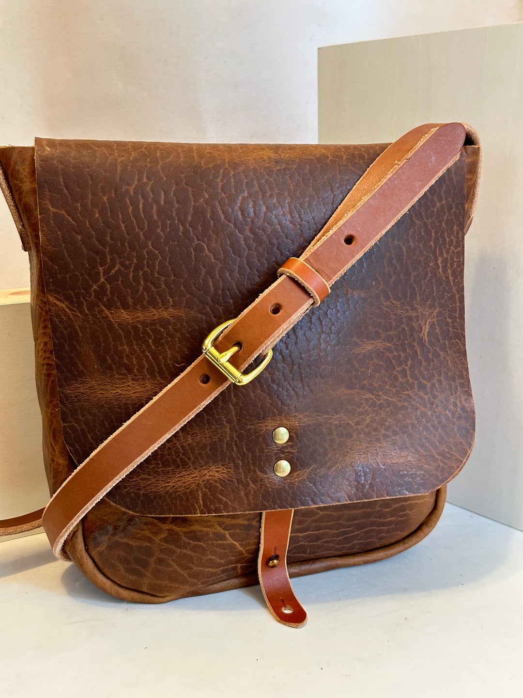 Shining Rock Goods small shrunken bison handmade leather crossbody handbag with brass hardware unisex light brown