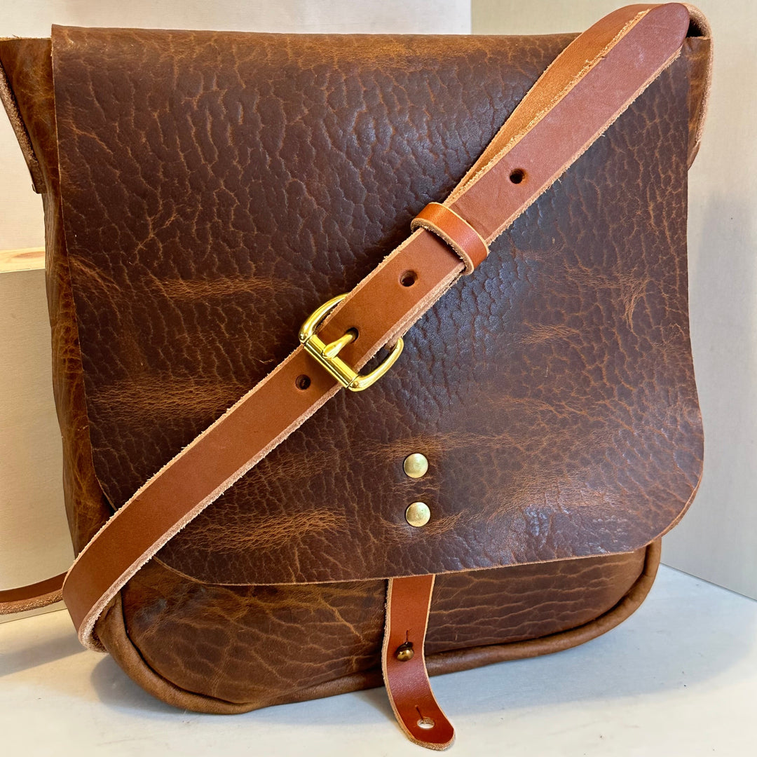 Our handmade Glazed Bison Explorer Mini Crossbody Leather Bag is made from a beautiful, rich warm leather with a deeply pebbled texture and gloss finis