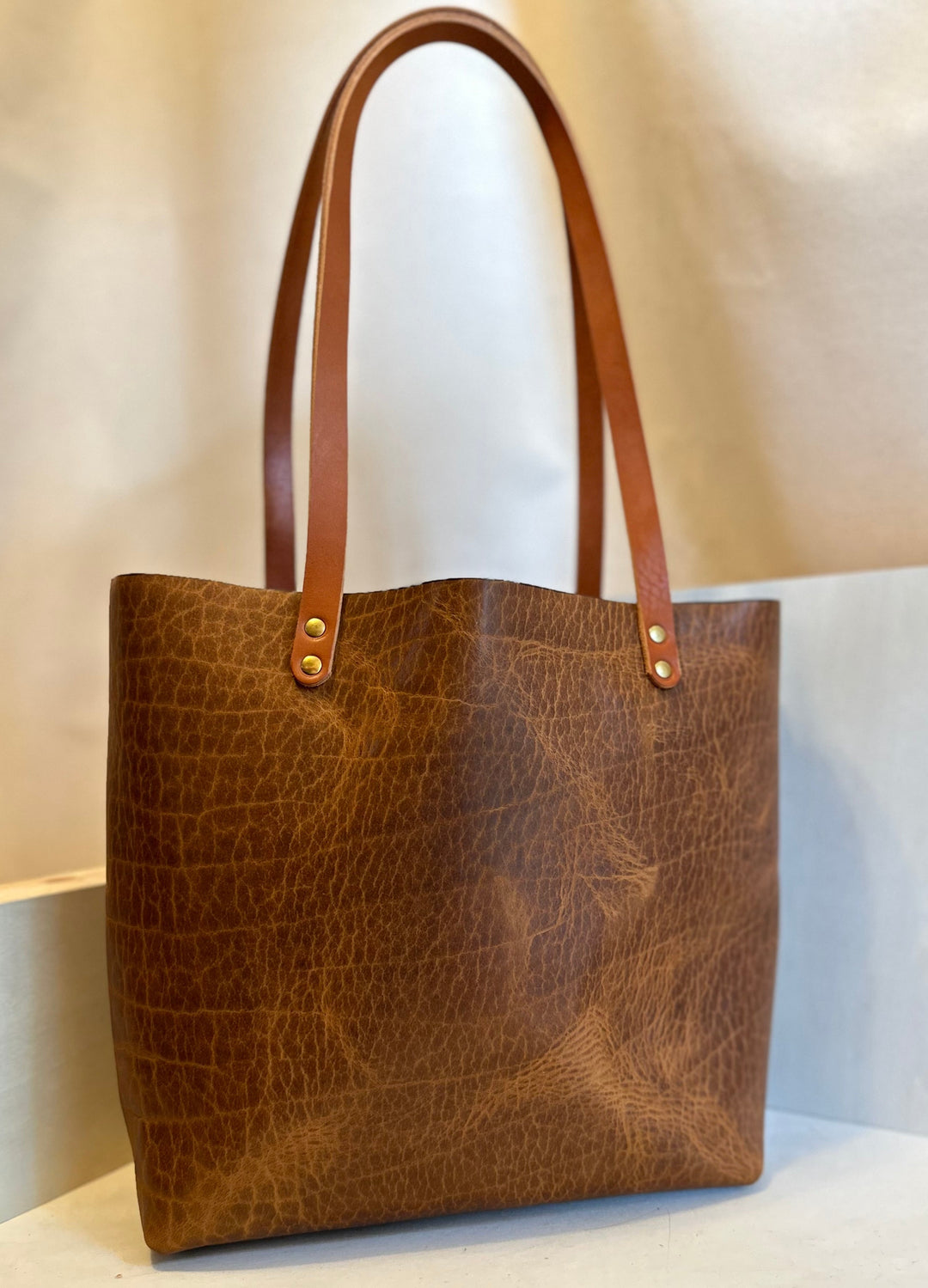 Our handmade Everyday Carry Large Glazed Bison Leather Tote Bag is a work of art, work horse, workin' it kinda bag.  Crafted from the highest quality, USA tanned, solid, top grain leather