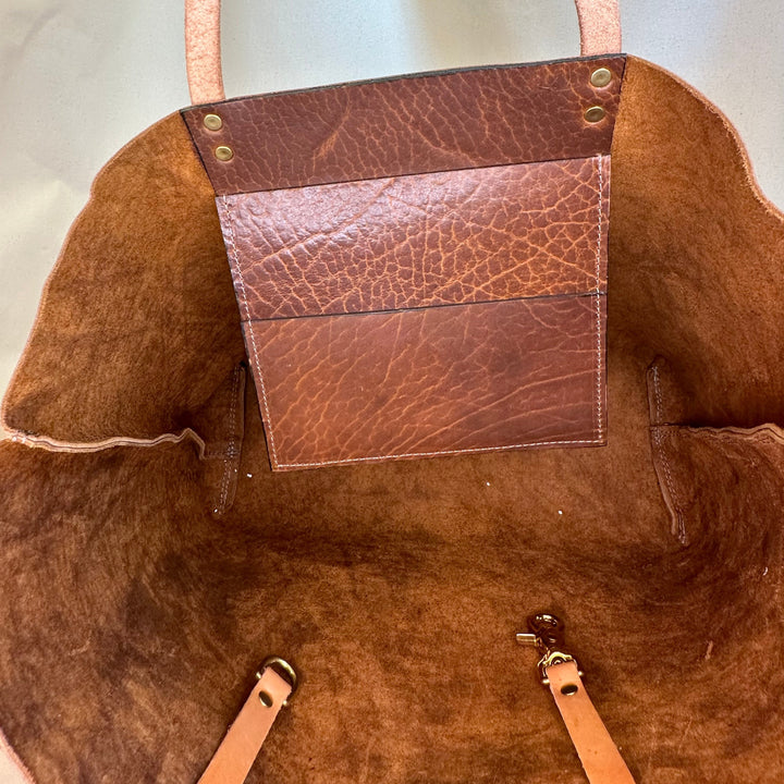 The Shining Rock Goods First Class LX Glazed Bison Leather Tote Bag is crafted from top grain, USA tanned leather, it is designed for maximum longevity and the quietest of luxury.