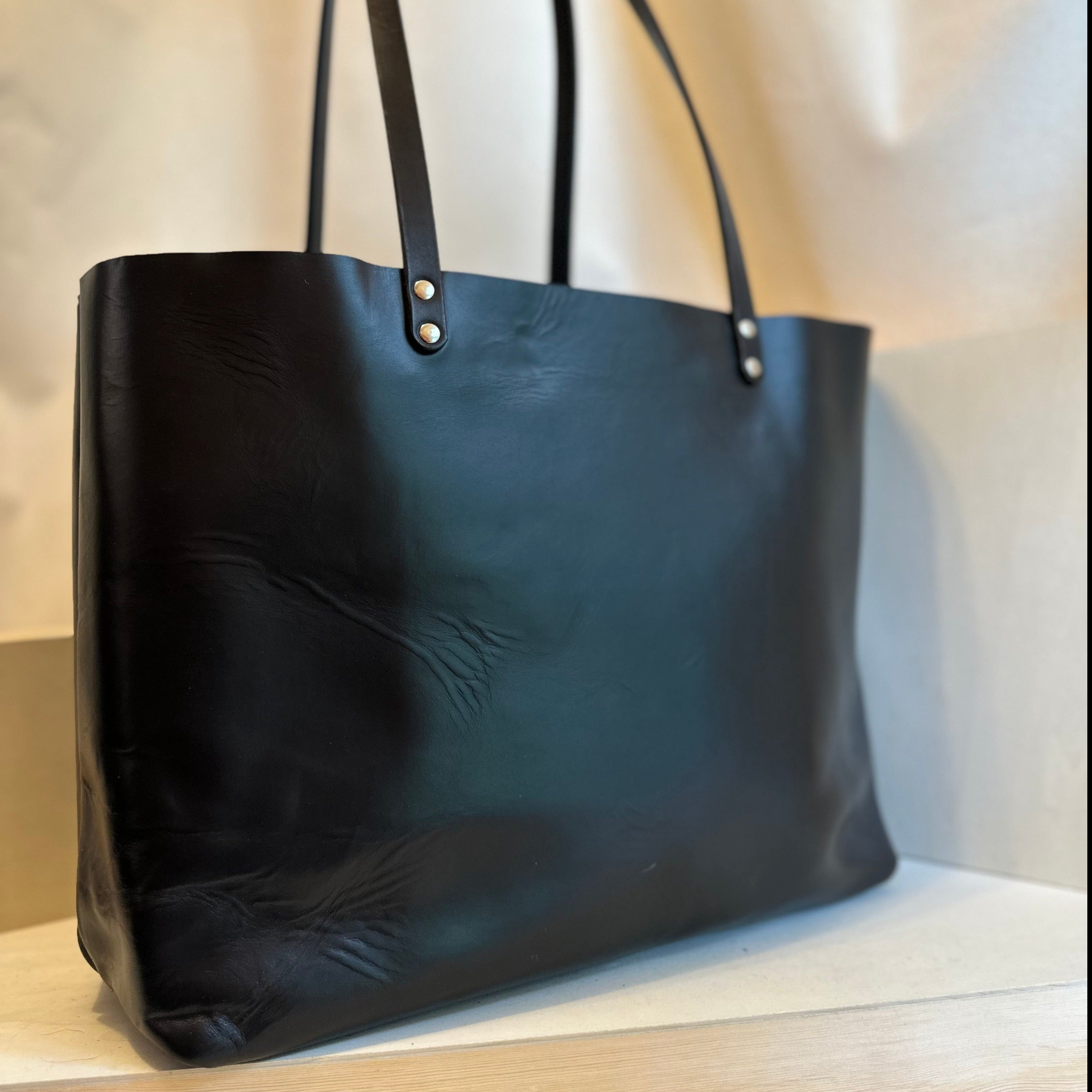 The Shining Rock Goods First Class LX Black Leather Tote Bag is crafted from top grain Horween Chrome XL, USA tanned leather, is designed for maximum longevity and the quietest of luxury.