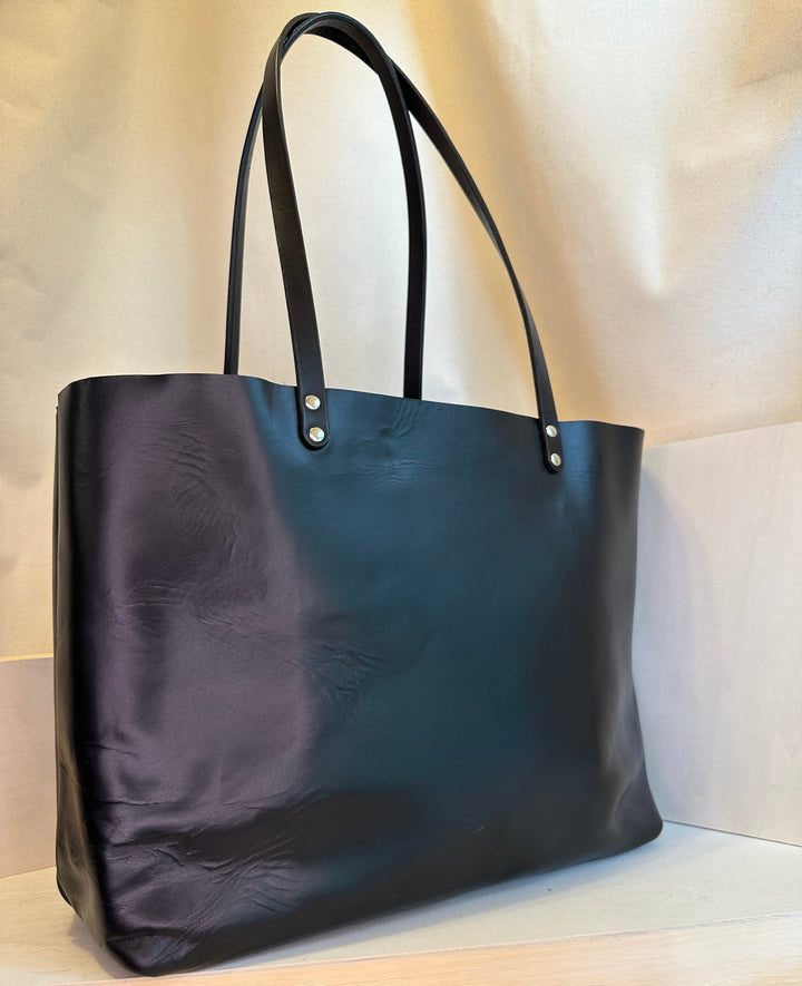 The Shining Rock Goods First Class LX Black Leather Tote Bag is crafted from top grain Horween Chrome XL, USA tanned leather, is designed for maximum longevity and the quietest of luxury.