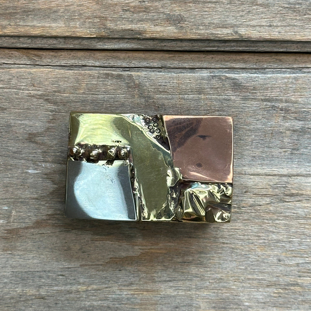 A unique handmade brass copper and nickel belt buckle designed by David M. Bowman. Made to fit an inch and a half belt.