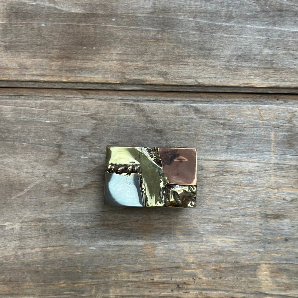A unique handmade brass copper and nickel belt buckle designed by David M. Bowman.  Made to fit an inch and a quarter belt.