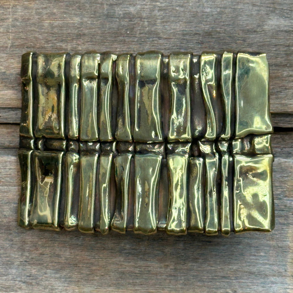 A solid brass handmade abstract "Spine" belt buckle by David M. Bowman.  Fits an inch and a half belt